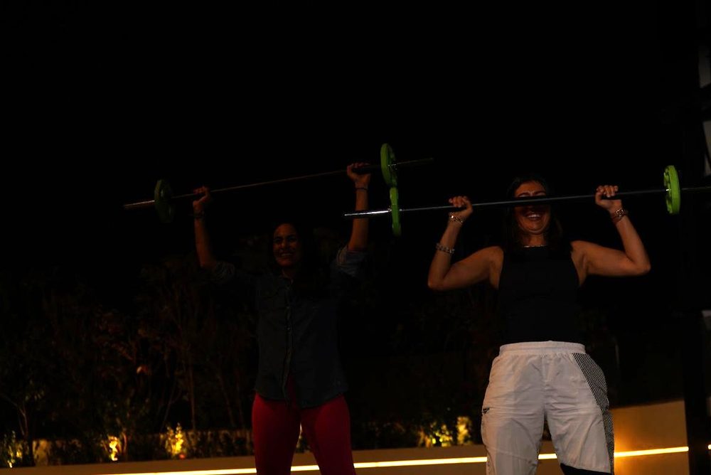 Rooftop barbell training at dusk