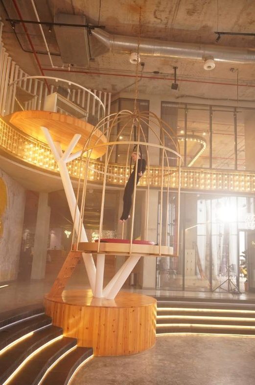 The Circus hall at LoCa Studios with the golden cage and stage