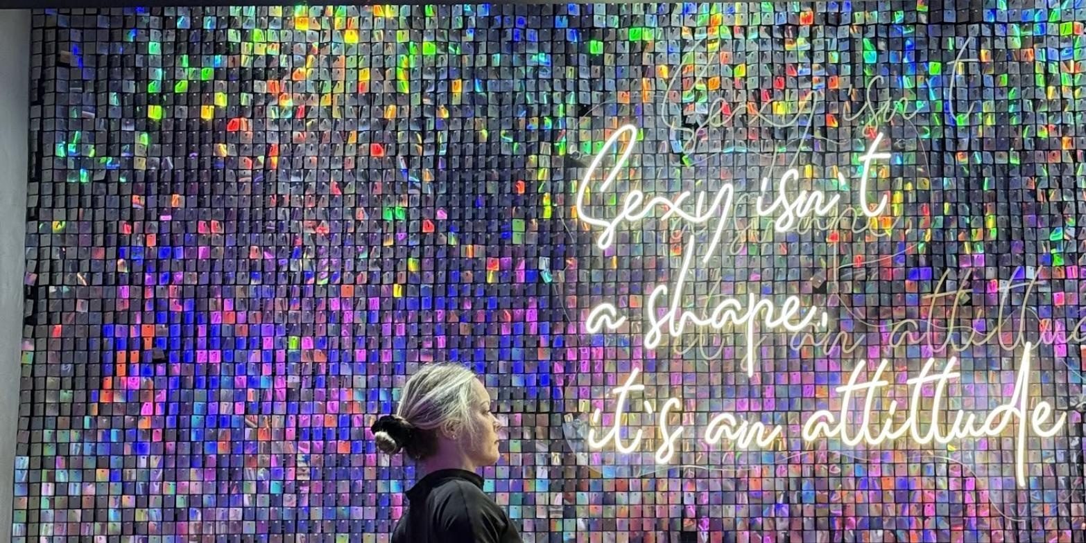 Sequin wall with neon sign