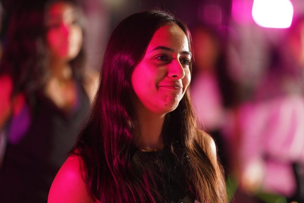 A guest smiling during a class at LoCa Studios